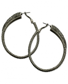 Gray matters on these sparkling clutchless hoops from GUESS. Pave crystals adorn a classic earring silhouette. Crafted in hematite tone mixed metal. Approximate drop: 2-1/4 inches. Gray matters on these sparkling clutchless hoops from GUESS. Pave crystals adorn a classic earring silhouette. Crafted in hematite tone mixed metal. Approximate drop: 2-1/4 inches.