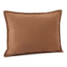 Inspired by the refined polish of menswear, this relaxed collection pairs solid brushed cotton and twill with faux suede trim and plaid. This simple decorative pillow in faux suede is a soft, masculine accent to the collection.