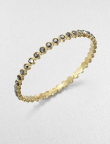 Lovely faceted glass stones in the soft hue of amethyst or a bold silver flare are dotted along a slender bangle with a golden finish.GlassGoldtoneDiameter, about 2.5Imported Lovely faceted glass stones in the soft hue of amethyst or a bold silver flare are dotted along a slender bangle with a golden finish.GlassGoldtoneDiameter, about 2.5Imported
