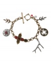 Eclectic elements. A comprehensive array of charms--including a cross, a medallion, a branch and leaf designs--join together in this unique bracelet from Lucky Brand. Adorned by semiprecious ruby-hued jade as well as colored crystals, it's set in gold tone and silver tone mixed metal. Includes a toggle closure. Approximate length: 7-6/10 inches.