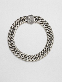 A signature link design of smooth, shiny sterling silver with wave design detail on the clasp.Sterling silverAbout 2 diam.Imported A signature link design of smooth, shiny sterling silver with wave design detail on the clasp.Sterling silverAbout 2 diam.Imported