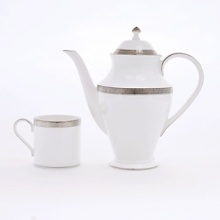 This pattern is named for the intriguing scroll design of anceint Celtic time pieces, and like its inspiration, this pattern features an artistically etched platinum design on white bone china. Shown: 5-pc. placesetting. Matching accessories also available. This pattern is named for the intriguing scroll design of anceint Celtic time pieces, and like its inspiration, this pattern features an artistically etched platinum design on white bone china. Shown: 5-pc. placesetting. Matching accessories also available.