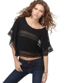Lace trim adds feminine flair to this Free People cropped top in a relaxed shape perfect for a boho look! Lace trim adds feminine flair to this Free People cropped top in a relaxed shape perfect for a boho look!