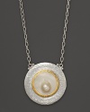 A Mabe pearl gleams at the center of this artful pendant necklace in sterling silver with 24K yellow gold accents. From Gurhan.