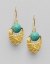 From the Lobe Collection. A round turquoise bead and hammered 24K gold crescent in a modern, chic design.Turquoise 24K gold Length, about 1½ Width, about ½ Ear hooks Imported 