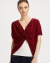 This v-neck, twist-front cashmere topper is perfect for snuggling luxuriously.CashmereShort sleevesPullover styleHand wash or dry cleanImported