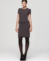 A fluttering peplum lends poetic dimension to a structured Gerard Darel sheath dress. Accentuate the sculptural silhouette with sheer black tights.