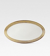 A beautiful serving platter in fine Limoges porcelain, made entirely by hand and finished with individually-applied 14k gold along the pearl border. From the Perlee Gold Collection Porcelain 14 X 7 Dishwasher safe Imported 
