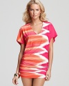 Carmen Marc Valvo's zig-zag print cover up will ensure you standout at the beach. Tropical tones lend chromatic cool -- simply pair with flat sandals to stun once you're out of the sun.
