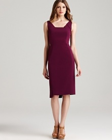 In a rich jewel-tone hue, Elie Tahari's plum-colored sheath dress boasts fashion-forward details like an asymmetric hem and pop-of-color contrasts. In a rich jewel-tone hue, Elie Tahari's plum-colored sheath dress boasts fashion-forward details like an asymmetric hem and pop-of-color contrasts.