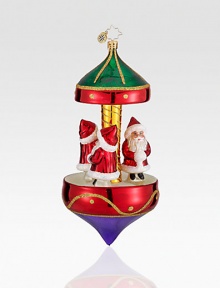 Miniature Santa figurines are set atop this glittery Christmas carousel. Hand-blownHand-painted6½ highMade in Poland Miniature Santa figurines are set atop this glittery Christmas carousel. Hand-blownHand-painted6½ highMade in Poland