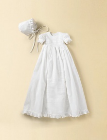 A lovely style with graceful embroidery and ruffle trim. Comes with matching bonnet Puff sleeves Gathered skirt for fullness Back button closure Two layers of cotton lining Cotton; dry clean Imported FIT RECOMMENDATION: Please note that this style runs small.