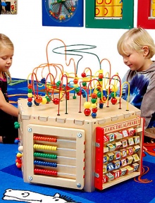 Wow...so much to keep little ones busy and teach at the same time in this delightful hexagonal play center. There are beads to push, gears to spin, alphabet blocks to flip, handles to move, mazes to trace and more, with fun and learning hand-in-hand all the while.Six sides with activitiesTop wire-and-bead mazesRoom for more than one child to play at a timeSturdy, safe and colorful19W X 19D X 26HWoodMade in USA Wow...so much to keep little ones busy and teach at the same time in this delightful hexagonal play center. There are beads to push, gears to spin, alphabet blocks to flip, handles to move, mazes to trace and more, with fun and learning hand-in-hand all the while.Six sides with activitiesTop wire-and-bead mazesRoom for more than one child to play at a timeSturdy, safe and colorful19W X 19D X 26HWoodMade in USA