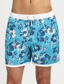 Tropical style hits the beach in a bold floral print with a breezy white waistband.Elastic drawstring waistBack patch pocketPolyamidePolyester liningMachine washImported