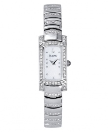 A sparkling take on a glamorous, vintage style. Features mother of pearl dial, curved crystal-accented bracelet and crystal bezel. Water resistant up to 30 meters. Three-year limited warranty. A sparkling take on a glamorous, vintage style. Features mother of pearl dial, curved crystal-accented bracelet and crystal bezel. Water resistant up to 30 meters. Three-year limited warranty.