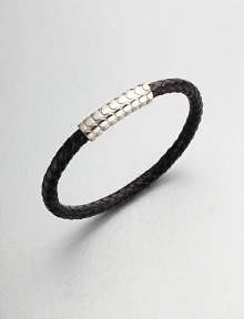 A simple design with modern sensibilities defines this woven leather bracelet, accented by a sterling silver clasp.LeatherSterling silverAbout 3 diam.Made in the United Kingdom