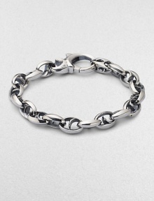 Bold oval links of polished sterling silver have not-so-sinister curved spikes in their centers.Sterling silver Length, about 8½ Lobster clasp Imported Bold oval links of polished sterling silver have not-so-sinister curved spikes in their centers.Sterling silver Length, about 8½ Lobster clasp Imported