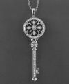 The key to chic sophistication. This diamond (1/5 ct. t.w.) encrusted key pendant is intricately crafted with enchanting, old-world detail. In sterling silver. Measures approximately 18 inches long with a 2-1/4 inch drop.