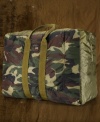 An ideal size for travel, a camouflage canvas duffle bag features an interior media pocket and ample space for all your storage needs.