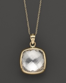 A bold, faceted crystal quartz glitters in a 14K yellow gold setting. A bold, faceted crystal quartz glitters in a 14K yellow gold setting.