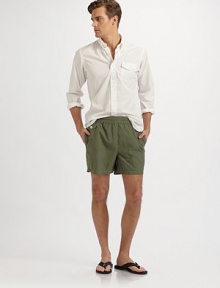 Swim trunk designed in a classic solid print and cut for a shorter, modern fit. Elastic waistband with hidden tie Back waist drainage grommets Logo embroidery Flap coin pocket at the right hip Back flap patch pocket Mesh lining Inseam, about 4¾ Polyester/nylon Machine wash Imported Swim trunk designed in a classic solid print and cut for a shorter, modern fit. Elastic waistband with hidden tie Back waist drainage grommets Logo embroidery Flap coin pocket at the right hip Back flap patch pocket Mesh lining Inseam, about 4¾ Polyester/nylon Machine wash Imported