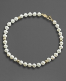 Everyday elegance, fit for any age. This lovely simulated pearl bracelet is accented with 14k gold beads. Everyday elegance, fit for any age. This lovely simulated pearl bracelet is accented with 14k gold beads.