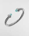 From the Cable Collection. An iconic design with aqua chalcedony caps accented in dazzling diamonds. Aqua chalcedonyDiamonds, .48 tcwSterling silverDiameter, about 2½Slip-on styleImported 