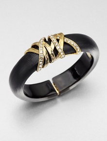 From the Lucite Modulor Collection. A subtly tapered design of hand-sculpted, hand-painted Lucite is wrapped with golden ribbons set with dazzling, square-cut Swarovski crystals.CrystalLuciteGoldtoneDiameter, about 2.4Width, about .9Hinged, with magnetic closureMade in USA From the Lucite Modulor Collection. A subtly tapered design of hand-sculpted, hand-painted Lucite is wrapped with golden ribbons set with dazzling, square-cut Swarovski crystals.CrystalLuciteGoldtoneDiameter, about 2.4Width, about .9Hinged, with magnetic closureMade in USA