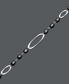 Decorate your wrist with the perfect finishing touch. This chic bracelet features a cut-out oval design accented by onyx beads (6 mm x 4 mm). Set in sterling silver. Approximate length: 7 inches. Decorate your wrist with the perfect finishing touch. This chic bracelet features a cut-out oval design accented by onyx beads (6 mm x 4 mm). Set in sterling silver. Approximate length: 7 inches.