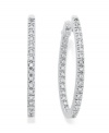 Reflect the light from every angle. These sparkling hoop earrings feature an in and out design decorated with round-cut diamonds (1/2 ct. t.w.). Set in 14k white gold. Approximate inch. 1 inch.