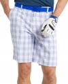 Feel as good as your swing looks in these plaid performance golf shorts from Izod featuring UPF 15 and fast-drying fabric.