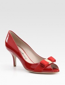 Delicate bow graces the front of this vibrant patent leather peep toe. Self-covered heel, 3 (75mm)Patent leather upperLeather lining and solePadded insoleMade in ItalyOUR FIT MODEL RECOMMENDS ordering true size. Delicate bow graces the front of this vibrant patent leather peep toe. Self-covered heel, 3 (75mm)Patent leather upperLeather lining and solePadded insoleMade in ItalyOUR FIT MODEL RECOMMENDS ordering true size.