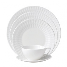 Embossed with clean, geometric patterns comprised of subtle diamond shapes, this attractive set of dinnerware is crafted in pure white bone china for a mannered elegance that complements your finest table setting. Embossed with clean, geometric patterns comprised of subtle diamond shapes, this attractive set of dinnerware is crafted in pure white bone china for a mannered elegance that complements your finest table setting.