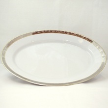 This exquisite formal collection is made from the finest Limoges porcelain. Adorned with ornate platinum accents and shimmering gold, it adds luxurious style to any table. This exquisite formal collection is made from the finest Limoges porcelain. Adorned with ornate platinum accents and shimmering gold, it adds luxurious style to any table.