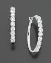 Round-cut cubic zirconia are set in 14k white gold. Earrings measure 3/4 inches.