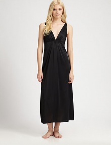 With a goddess-like appeal, this silky knit feels as divine as it looks. Deep plunging V neckline Pleated bodice Empire waist with pleating Deep V back About 54 from shoulder to hem PolyesterMachine washImported With a goddess-like appeal, this silky knit feels as divine as it looks. Deep plunging V neckline Pleated bodice Empire waist with pleating Deep V back About 54 from shoulder to hem PolyesterMachine washImported