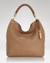 Adopt an luxurious approach to accessorizing with this shoulder bag from Michael Kors. A classic design and rich, textured leather make this spacious style an ever-chic investment.