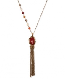 Addition by attraction. Crafted from gold tone base metal, Lucky Brand's pendant necklace features a semi-precious reconstituted calcite red stone at the center. Semi-precious carnelian, yellow jade, citrine and smokey quartz beads adorn the side. Approximate length: 23 inches + 2-inch extender. Approximate drop: 5 inches. Addition by attraction. Crafted from gold tone base metal, Lucky Brand's pendant necklace features a semi-precious reconstituted calcite red stone at the center. Semi-precious carnelian, yellow jade, citrine and smokey quartz beads adorn the side. Approximate length: 23 inches + 2-inch extender. Approximate drop: 5 inches.