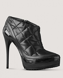 Bold leather booties are quilted and finished with a shiny dash of patent. By Burberry. Bold leather booties are quilted and finished with a shiny dash of patent. By Burberry.
