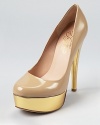 With a gleaming gold platform and heel, these patent Alejandro Ingelmo pumps lend bold evening style.