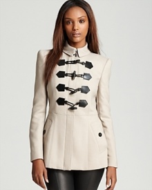 Luxe leather embellishments on this toggle-closure Burberry London jacket lend military-inspired style to the directional layering piece. Signature check lining lends an iconic touch. Luxe leather embellishments on this toggle-closure Burberry London jacket lend military-inspired style to the directional layering piece. Signature check lining lends an iconic touch.