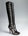 Corso Como's timeless Darling boots feel classically feminine--these tall black boots earn their spot in your shoe wardrobe in soft leather and a knee-high silhouette.