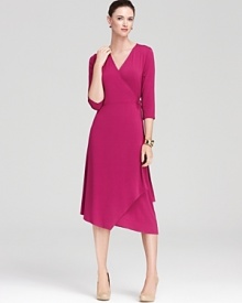 A jewel-tone palette breathes distinctive life into an Eileen Fisher wrap dress, finished with an angled hem for a strikingly modern silhouette. A jewel-tone palette breathes distinctive life into an Eileen Fisher wrap dress, finished with an angled hem for a strikingly modern silhouette.