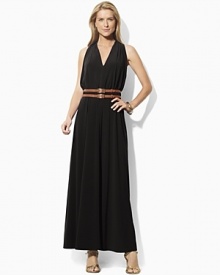 Crafted in sleek matte jersey, a flowing maxi dress is designed with a chic cutaway shoulder and belted waist for a figure-flattering look. Crafted in sleek matte jersey, a flowing maxi dress is designed with a chic cutaway shoulder and belted waist for a figure-flattering look.