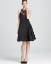 Exude elegant soirée style with this embellished Milly dress. A sheer neckline adds allure.