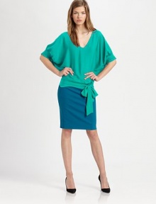 Elegant dolman sleeves and a self-tie at the hem sweeten this silk-rich confection. Rounded v-neckElbow-length dolman sleevesSelf-tie at hemSmocked back hem95% silk/5% spandexDry cleanImportedModel shown is 5'9 (175cm) wearing US size 4. Elegant dolman sleeves and a self-tie at the hem sweeten this silk-rich confection. Rounded v-neckElbow-length dolman sleevesSelf-tie at hemSmocked back hem95% silk/5% spandexDry cleanImportedModel shown is 5'9 (175cm) wearing US size 4.