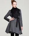 From color to construction, this Dawn Levy coat perfectly balances asymmetrical elements to create a supremely feminine look of on-trend sophistication.