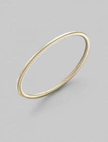 A unique bangle of 18k gold, polished on the outside with a twisted Yurman cable on the inside. 18k yellow gold Diameter, about 2½ Made in USA A unique bangle of 18k gold, polished on the outside with a twisted Yurman cable on the inside. 18k yellow gold Diameter, about 2½ Made in USA