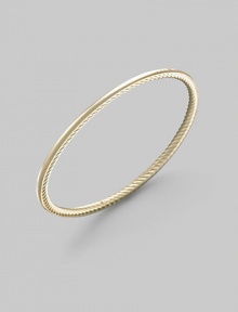 A unique bangle of 18k gold, polished on the outside with a twisted Yurman cable on the inside. 18k yellow gold Diameter, about 2½ Made in USA