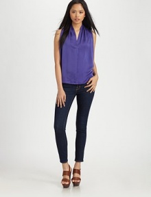 Vivacious silk v-neck with a hidden button front and self tie at the waist. V-neckSleevelessHidden button frontSelf tie at waistSilkDry cleanImported Vivacious silk v-neck with a hidden button front and self tie at the waist. V-neckSleevelessHidden button frontSelf tie at waistSilkDry cleanImported